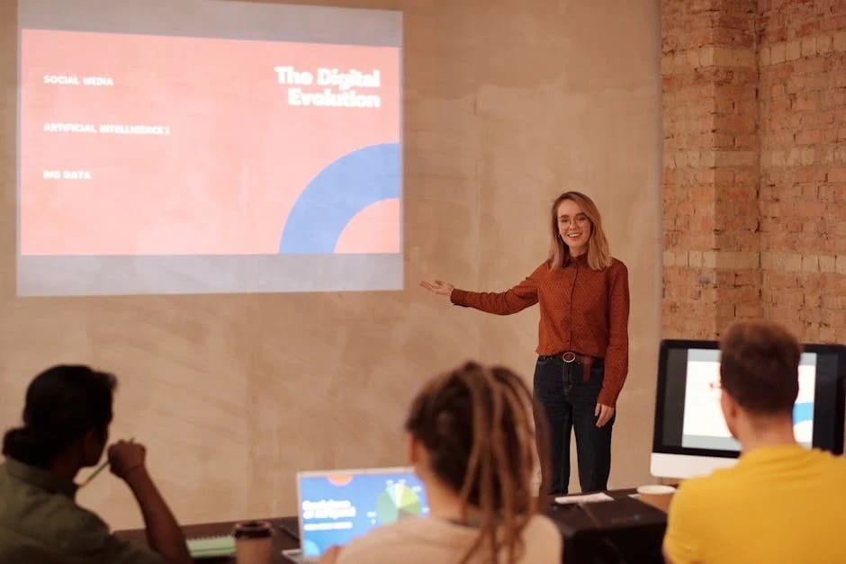 A woman presenting on "The Digital Evolution" with topics like social media, AI for business operations, and big data to a small audience in a classroom setting.