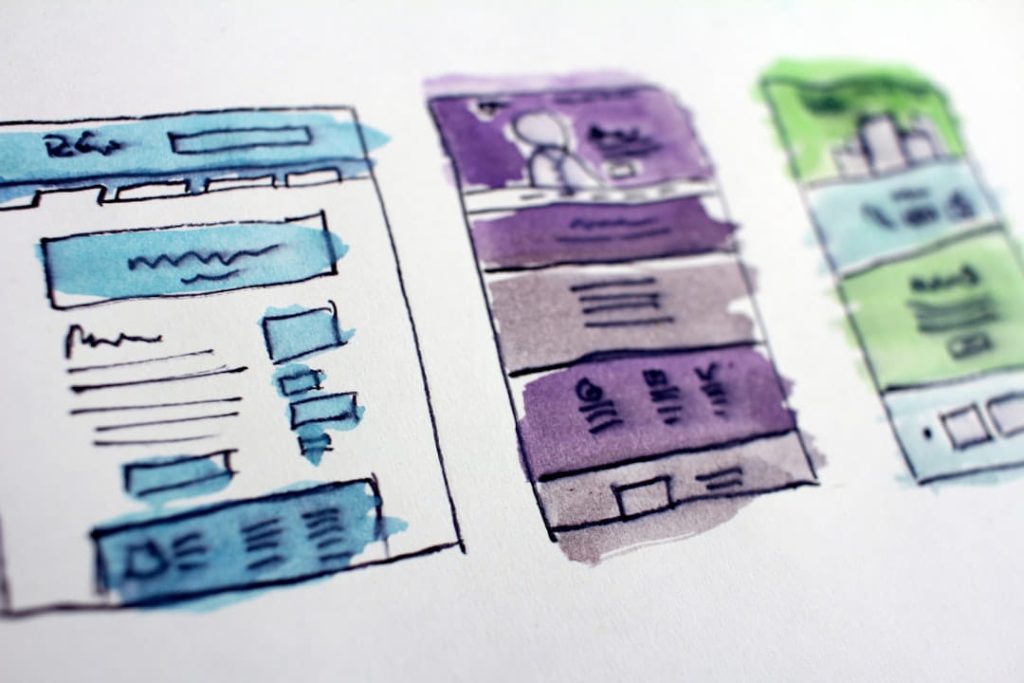 Hand-drawn wireframes showing early website launch checklist design and layout planning.