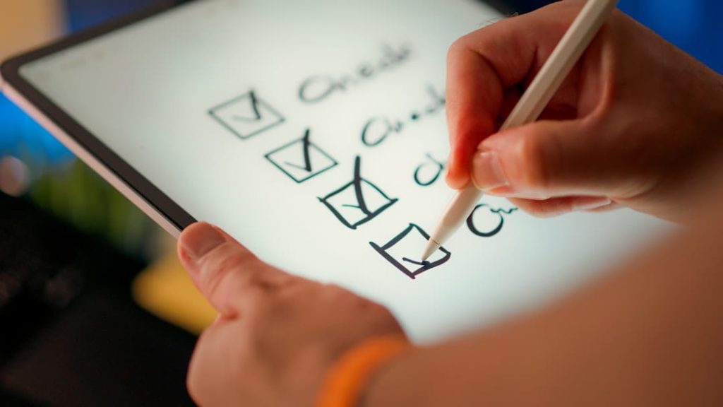 Tablet checklist image illustrating customer satisfaction survey questions and task completion.