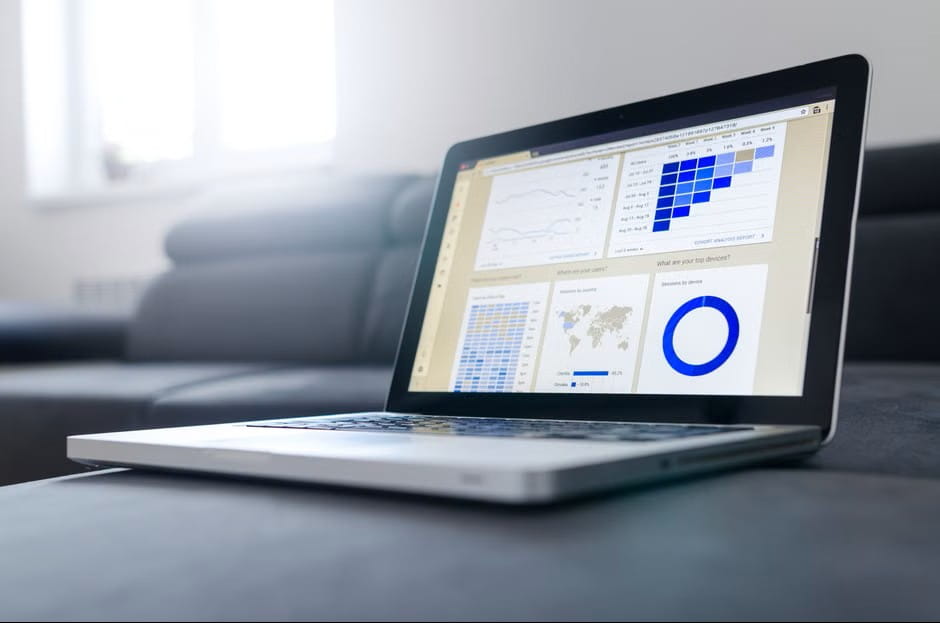 analytics dashboard on laptop supporting research on great banks for small business.