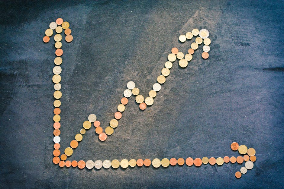 A line graph made of coins on a dark surface, symbolizing financial growth and startup funding.